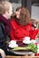 Happy couple dating in Parisian cafe