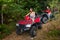 Happy couple driving four-wheelers ATV