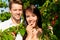 Happy couple eating cherries in summer