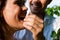 Happy couple eating cherries in summer