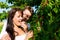 Happy couple eating cherries in summer