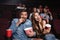 Happy couple eating popcorn and laughing