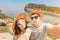 Happy couple embraces and takes a selfie against the background of a wonderful resort island and the azure sea. The concept of