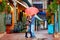 Happy couple having fun on colorful street