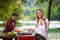 Happy couple having picnic french dinner party outdoor