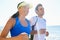 Happy couple, jog and fitness in beach, workout and active with smile, training and sunrise for run. Man, woman and