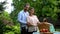 Happy couple looking at camera, preparing for picnic, social welfare, wellness