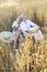 Happy couple in love in wheat field