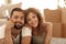 Happy couple lying on the carpet on the blurred background