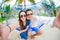 Happy couple making selfie relaxing in hammock