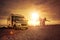 Happy couple with mobile home on the beach