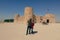 Happy Couple near the Al Zubara Fort, historic Qatari military fortress, in the ancient town of Zubarah