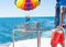 Happy couple Parasailing in Dominicana beach in summer. Couple under parachute hanging mid air.