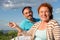 Happy couple at picnic. Romantic concept at the beach. Cheerful couple having fun on summer vacation