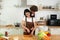 Happy couple preparing together yummy lunch Man and girl standing in kitchen at home on first dating Spouses enjoy warm