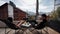 Happy couple relaxes at balcony terrace with mountains view, Swiss Alps. Lovers talk and have breakfast, enjoy the view.