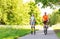 Happy couple with rollerblades and bicycle riding