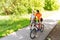 Happy couple with rollerblades and bicycle riding