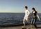 Happy couple running on beach