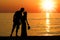 A happy couple by the sea in nature silhouette weekend travel