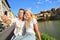 Happy couple selfie photo on travel in Florence