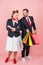 Happy couple at shopping time. Man holds lot of colored bags with presents for woman. pin-up styled couple on rose background