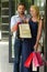 Happy couple shopping together. Woman with blonde hair