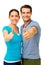 Happy Couple Showing Thumbs Up Sign