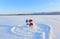 Happy couple of smiling snowman. Blue red hat and scarf. Painted heart and 2019 on the snow. Happy St. Valentine`s day.