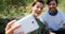 Happy couple taking selfie from mobile in olive farm 4k