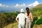 Happy couple trekking in mountains, hiking tourists