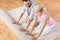 Happy couple unrolling carpet or rug at home