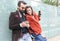 Happy couple using mobile phone for shopping online - Fashion people having fun with smartphone surfing in internet - Trends,