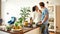 Happy couple, vegetarians looking into each other eyes before preparing a healthy meal in the kitchen together