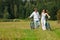 Happy couple walking in summer meadow