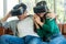 Happy couple watching video in virtual reality VR