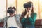 Happy couple watching video in virtual reality VR