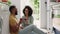 Happy couple, wine and toast on kitchen floor with smile, drink together and love conversation in home. Black couple