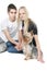 Happy couple with yorkshire terrier over white