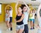 Happy couples of adults practicing salsa in studio