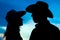 A happy cowboy couple silhouette background