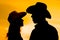 A happy cowboy couple silhouette background