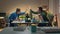 Happy coworkers giving five to each other at computer table. Guys enjoying break