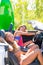 Happy crazy teen surfer girls smiling on car