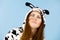 Happy crazy woman in cow costume