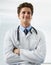Happy, crossed arms and portrait of man doctor with stethoscope for positive, good and confident attitude. Smile, pride
