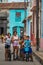 Happy Cuban boy and girl capture portrait in poor colorful colonial alley with smile face, in Camaguey, Cuba, America.