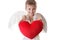 Happy cupid boy with wings holding red plush heart