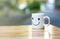 Happy cups on wood table with bokeh, about love concept