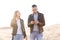 Happy and cute adorable adult couple of millennial hipsters, man with woman girlfriend walking, have fun play, laugh,smile and